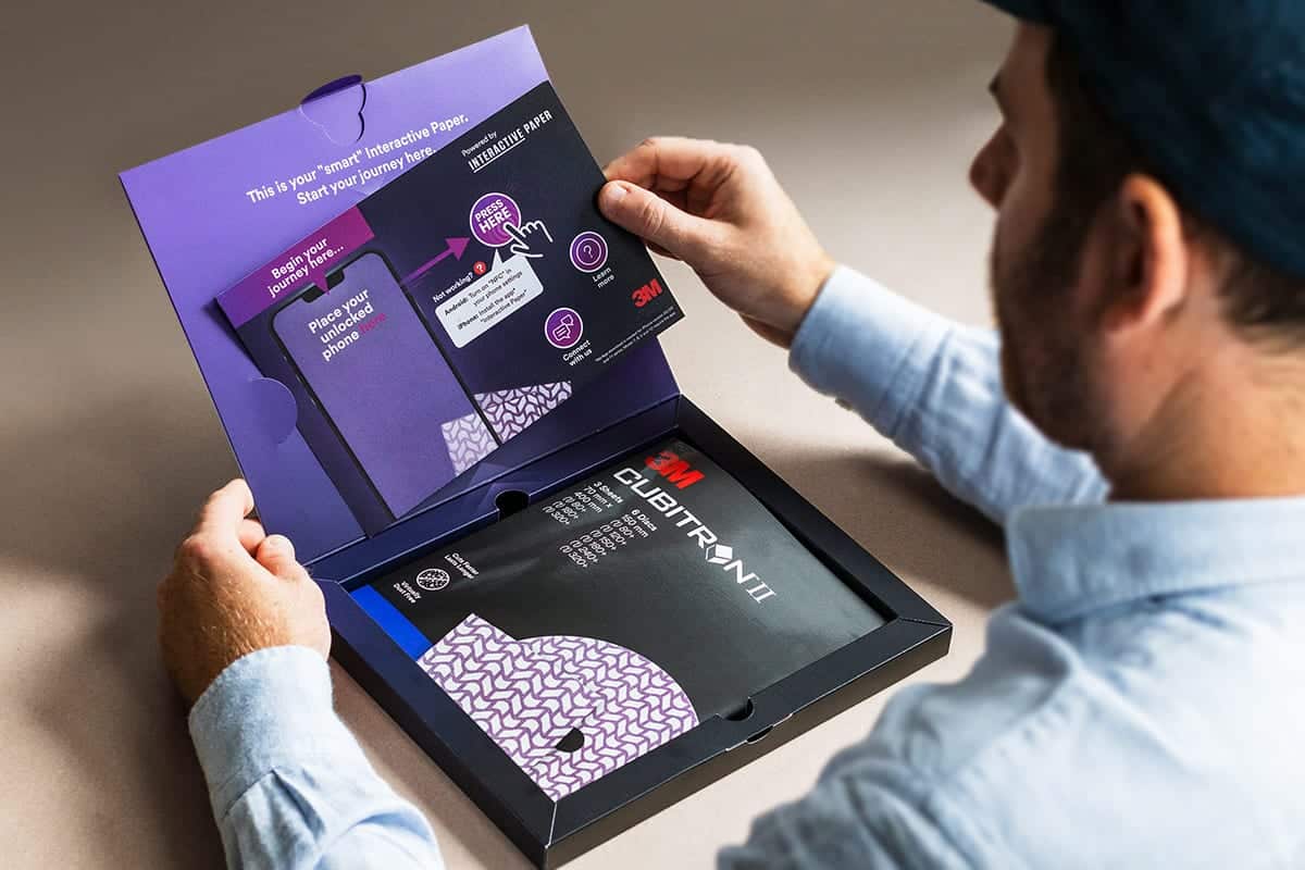 A man opening a premium box