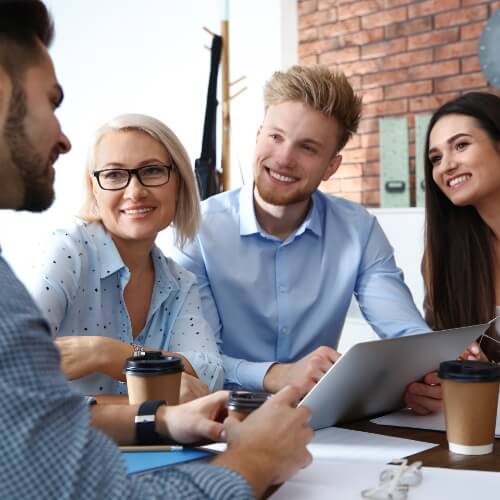 Business people discussing work matters at table