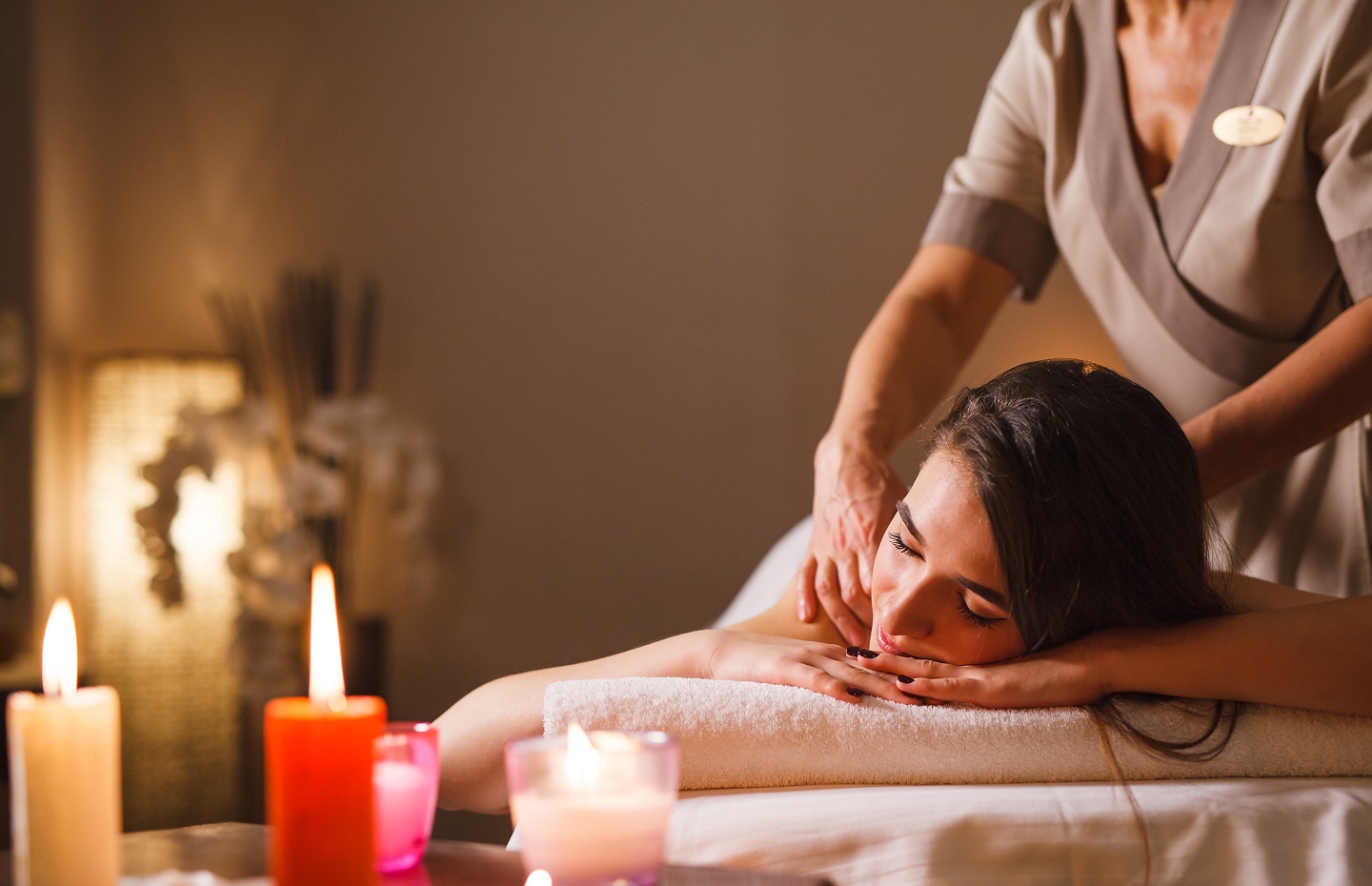 Girl getting a massage in the spa salon