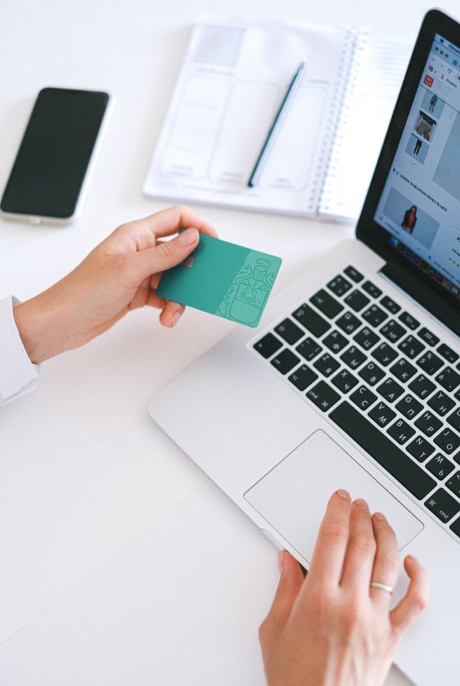 A person buying something online with their credit card